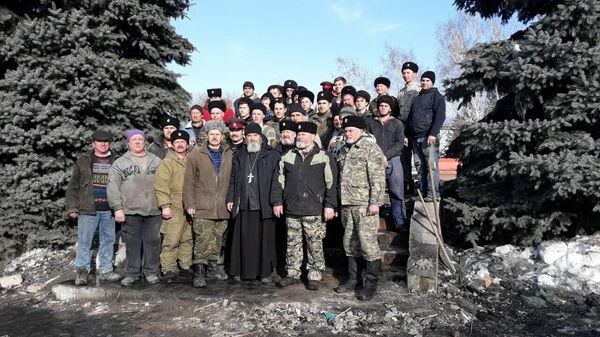 Семиреченские казаки на ступеньках разобранного после пожара храма Архангела Михаила с настоятелем иеромонахом Варсонофием (Ларионовым). 17 февраля 2018 года. Алматинская область, станица Михайловская, село Тургень Семиреченские казаки на ступеньках разобранного после пожара храма Архангела Михаила с настоятелем иеромонахом Варсонофием (Ларионовым). 17 февраля 2018 года. Алматинская область, станица Михайловская, село Тургень