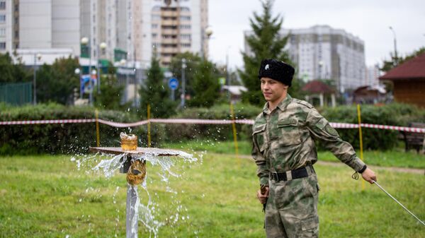 Участник соревнований на фестивале казачьего военного искусства Участник соревнований на фестивале казачьего военного искусства
