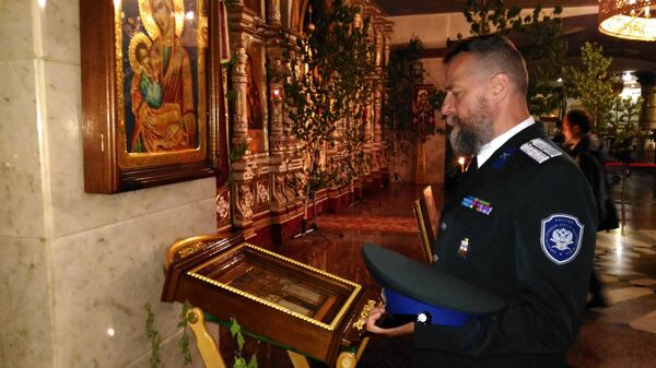 Казак ОВКО Паскаль Жерар в церкви